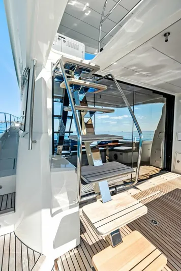 Anna Louise Yacht Photos Pics Prestige 590 Flybridge 2022 yacht with modern staircase and ocean view.