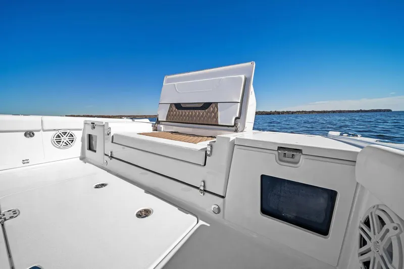 Your Next Boat! Yacht Photos Pics Manufacturer Provided Image: 2026 Blackfin 262 HB boat interior with seating, white deck, and ocean view.