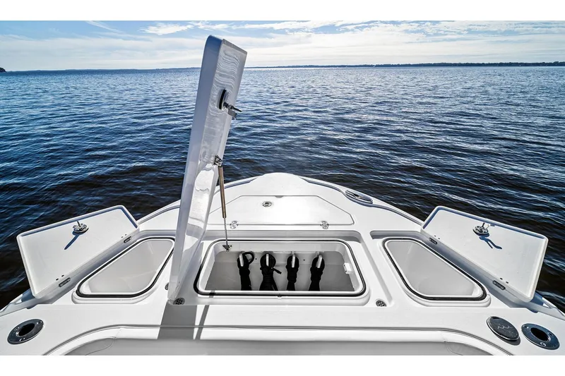 Your Next Boat! Yacht Photos Pics Manufacturer Provided Image: 2026 Blackfin 262 HB boat bow with open storage compartments on a calm lake.