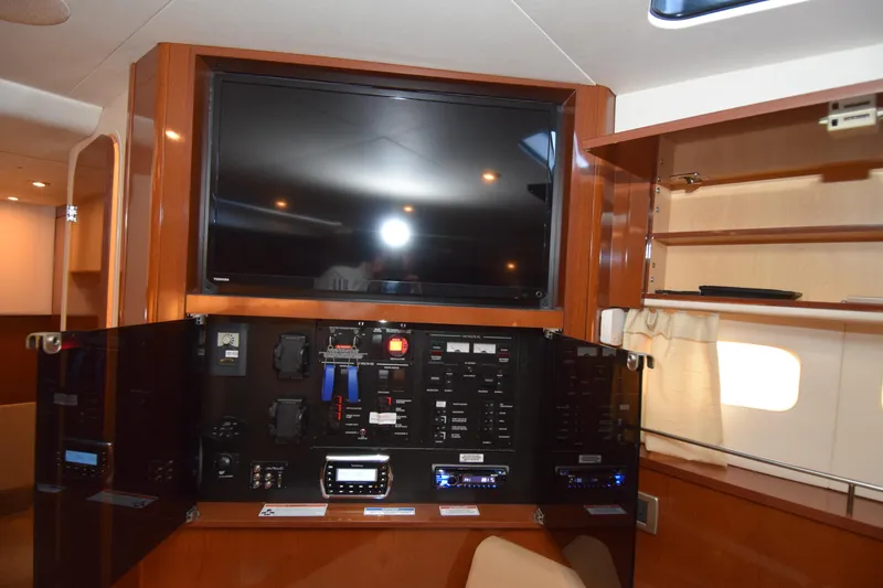 Just Plane Fun Yacht Photos Pics Interior of 2014 Sea Ray 350 Sundancer with control panel and mounted TV.