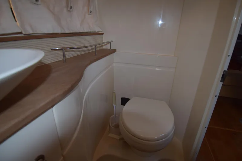 Just Plane Fun Yacht Photos Pics 2014 Sea Ray 350 Sundancer bathroom with modern fixtures and compact design.