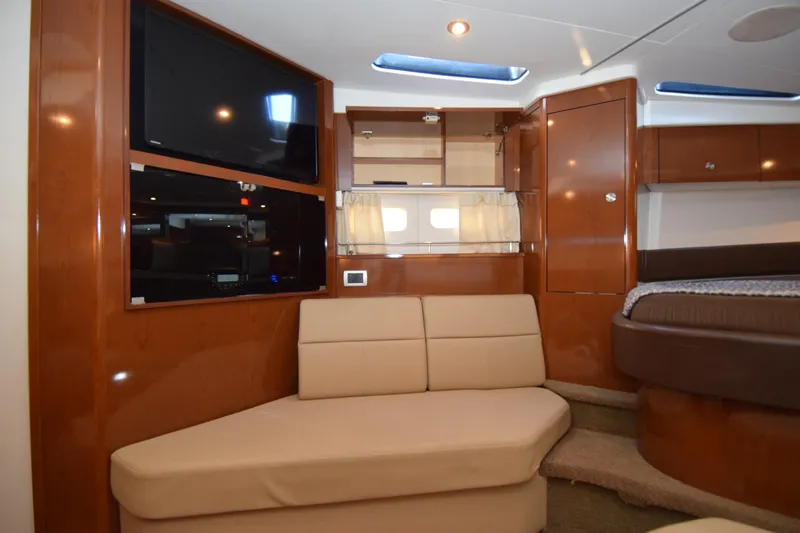 Just Plane Fun Yacht Photos Pics Luxurious interior of 2014 Sea Ray 350 Sundancer yacht with beige seating and modern amenities.