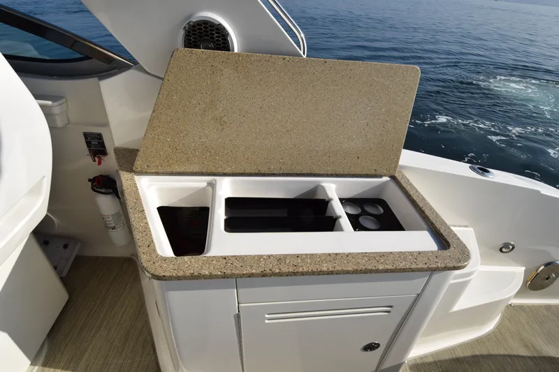 Just Plane Fun Yacht Photos Pics 2014 Sea Ray 350 Sundancer boat kitchenette with countertop and storage.