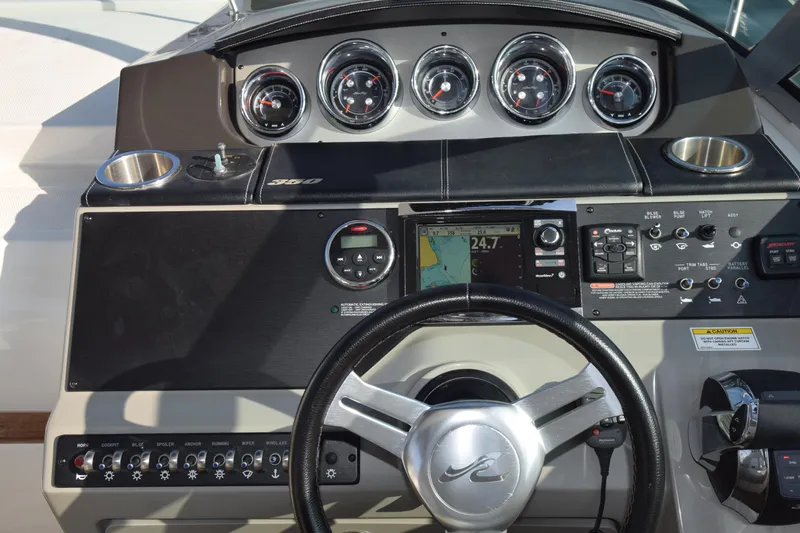 Just Plane Fun Yacht Photos Pics 2014 Sea Ray 350 Sundancer dashboard with gauges and navigation system.