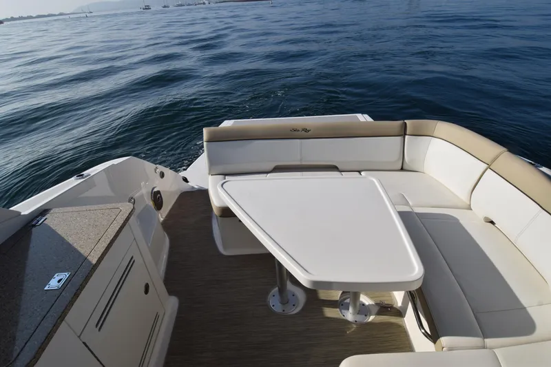 Just Plane Fun Yacht Photos Pics 2014 Sea Ray 350 Sundancer boat interior with seating and table on calm water.