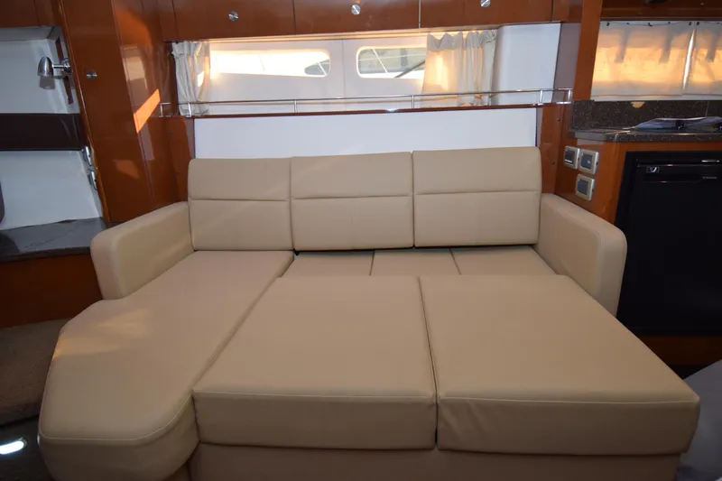 Just Plane Fun Yacht Photos Pics Luxurious beige sofa in 2014 Sea Ray 350 Sundancer yacht interior.