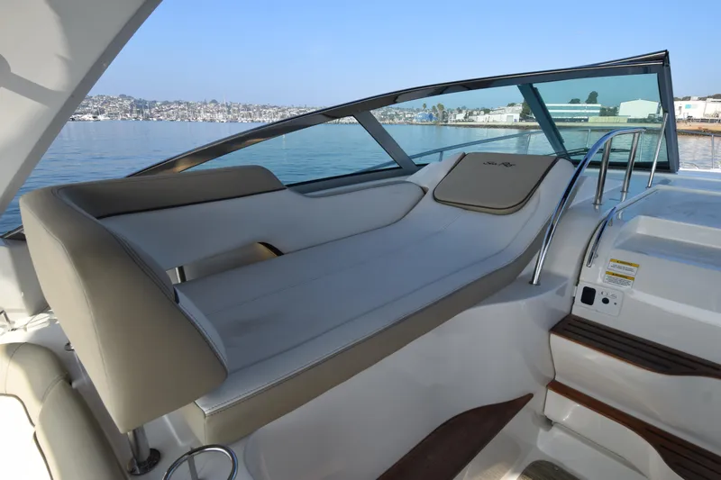 Just Plane Fun Yacht Photos Pics 2014 Sea Ray 350 Sundancer boat interior with sleek seating and waterfront view.