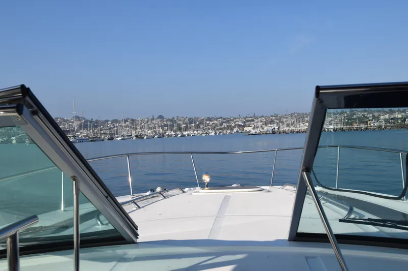 Just Plane Fun Yacht Photos Pics View from 2014 Sea Ray 350 Sundancer yacht, overlooking a marina under clear blue skies.