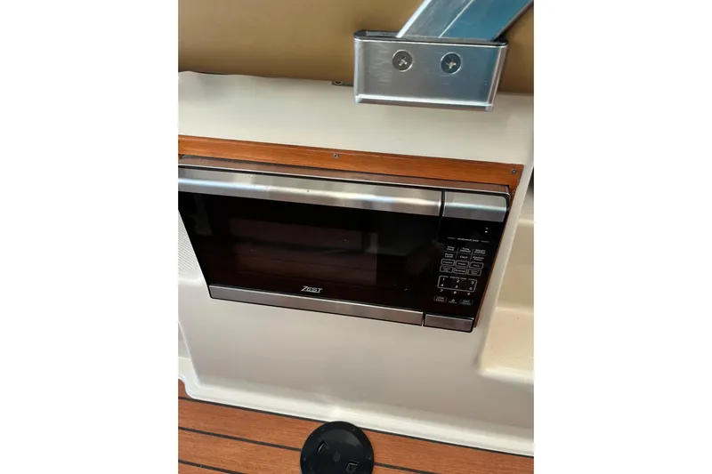 Skylark Yacht Photos Pics Microwave in 2025 Ranger Tugs R23 boat interior, featuring wood accents and modern design.