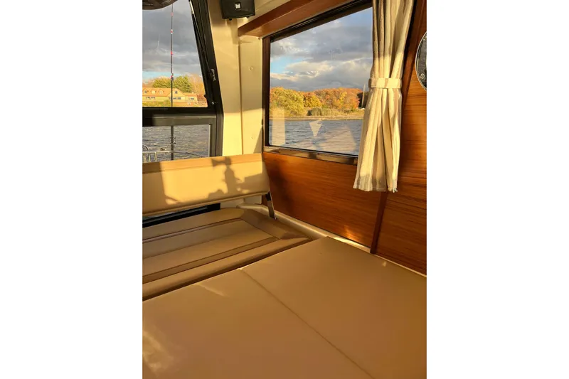 Skylark Yacht Photos Pics Interior of 2025 Ranger Tugs R23 boat with river view through window.