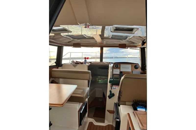 Skylark Yacht Photos Pics Interior of 2025 Ranger Tugs R23 boat with modern navigation equipment and seating.