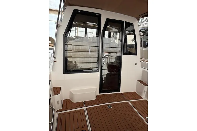 Skylark Yacht Photos Pics 2025 Ranger Tugs R23 boat interior with sleek design and wooden flooring.
