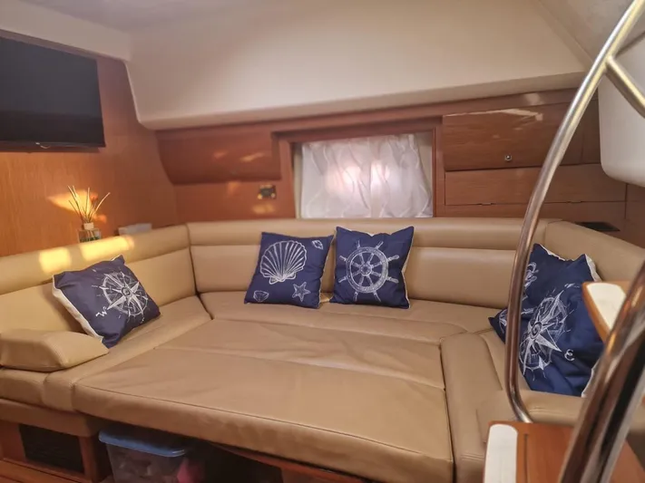  Yacht Photos Pics Luxurious interior of 2008 Jeanneau Prestige 38 S yacht with nautical-themed cushions.