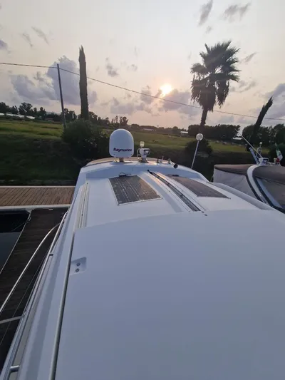  Yacht Photos Pics 2008 Jeanneau Prestige 38 S yacht at sunset, docked with scenic background.