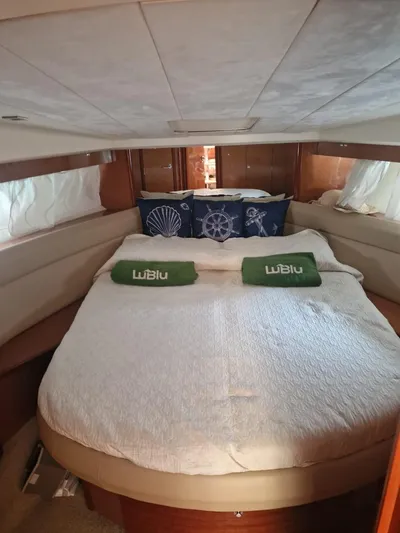  Yacht Photos Pics Luxurious cabin interior of 2008 Jeanneau Prestige 38 S yacht with cozy bedding.