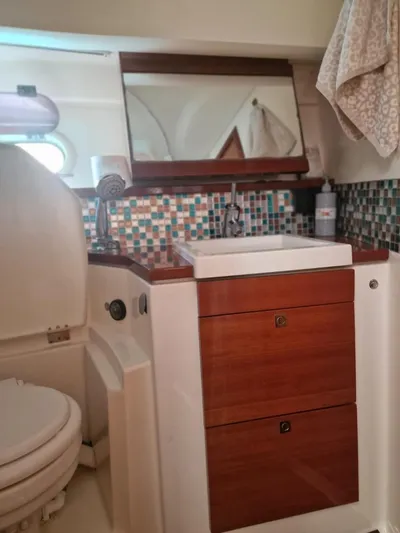  Yacht Photos Pics Bathroom interior of 2008 Jeanneau Prestige 38 S yacht with modern sink and mosaic tiles.