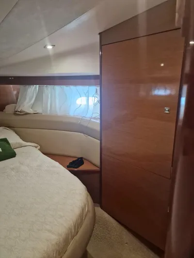  Yacht Photos Pics Luxurious cabin interior of 2008 Jeanneau Prestige 38 S yacht, featuring elegant wood finishes.