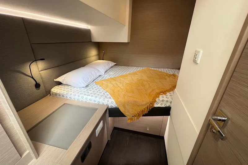 Amajen Yacht Photos Pics Cozy bedroom interior of 2022 Fountaine Pajot Aura 51 yacht with modern design.