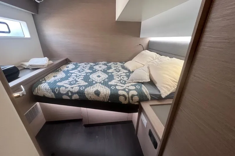 Amajen Yacht Photos Pics Cozy bedroom in 2022 Fountaine Pajot Aura 51 yacht with patterned bedding.