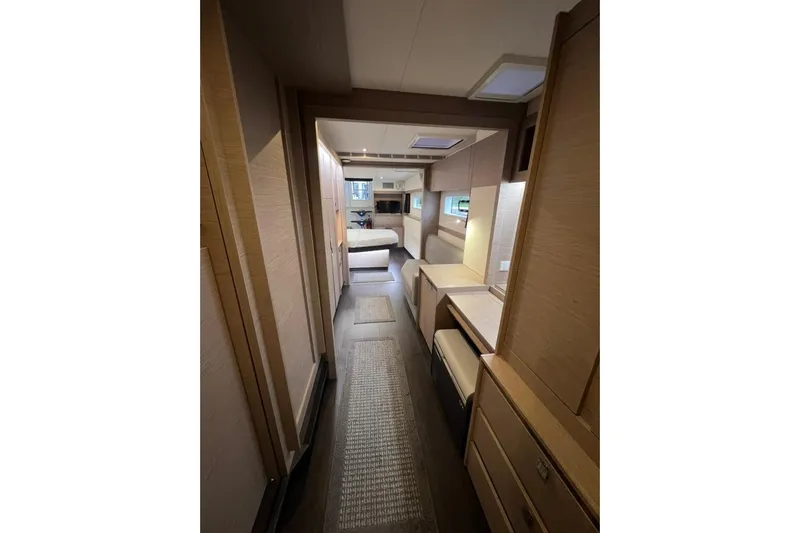 Amajen Yacht Photos Pics Interior of 2022 Fountaine Pajot Aura 51 yacht, featuring modern wood finishes and cozy layout.