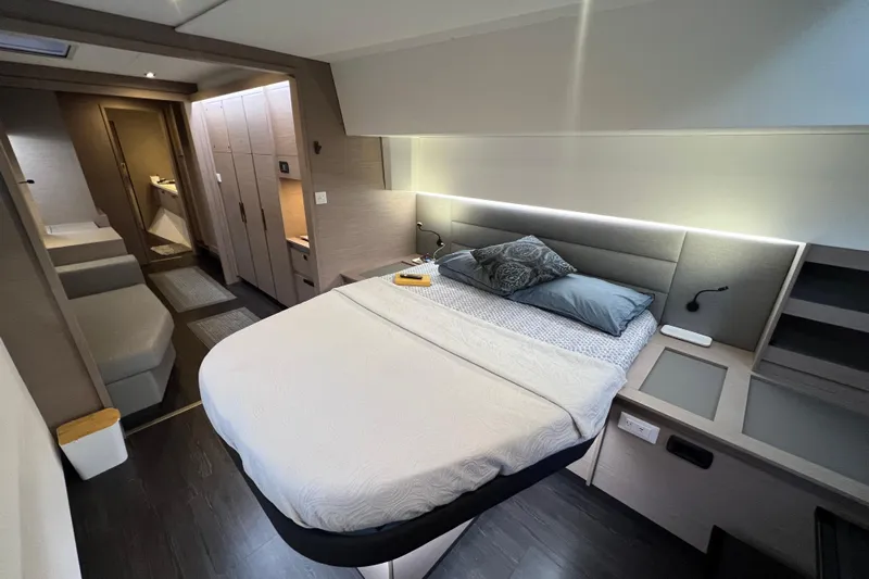 Amajen Yacht Photos Pics Luxurious bedroom interior of 2022 Fountaine Pajot Aura 51 yacht, featuring modern design.