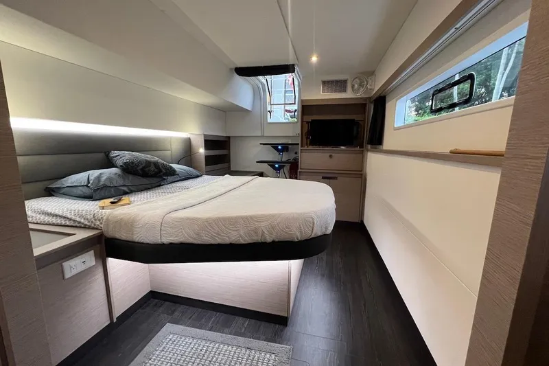 Amajen Yacht Photos Pics Luxurious bedroom interior of 2022 Fountaine Pajot Aura 51 yacht, featuring modern design and cozy ambiance.