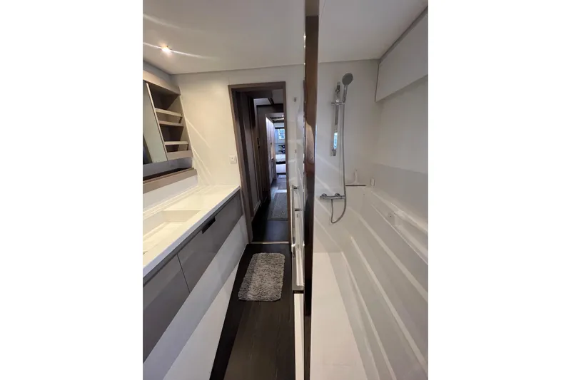 Amajen Yacht Photos Pics Modern bathroom interior of 2022 Fountaine Pajot Aura 51 yacht, featuring sleek design and fixtures.