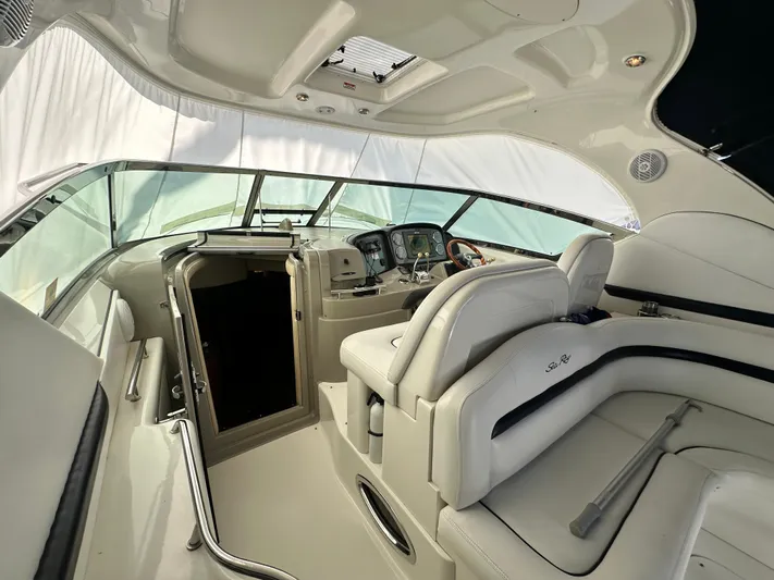 Bad Kitty Yacht Photos Pics Interior of 2007 Sea Ray 380 Sundancer yacht with luxurious seating and helm.