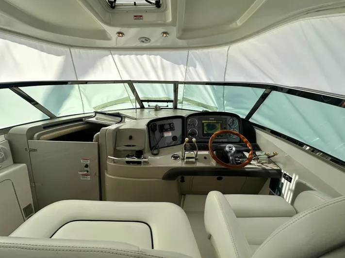Bad Kitty Yacht Photos Pics 2007 Sea Ray 380 Sundancer helm with leather seats and modern navigation controls.