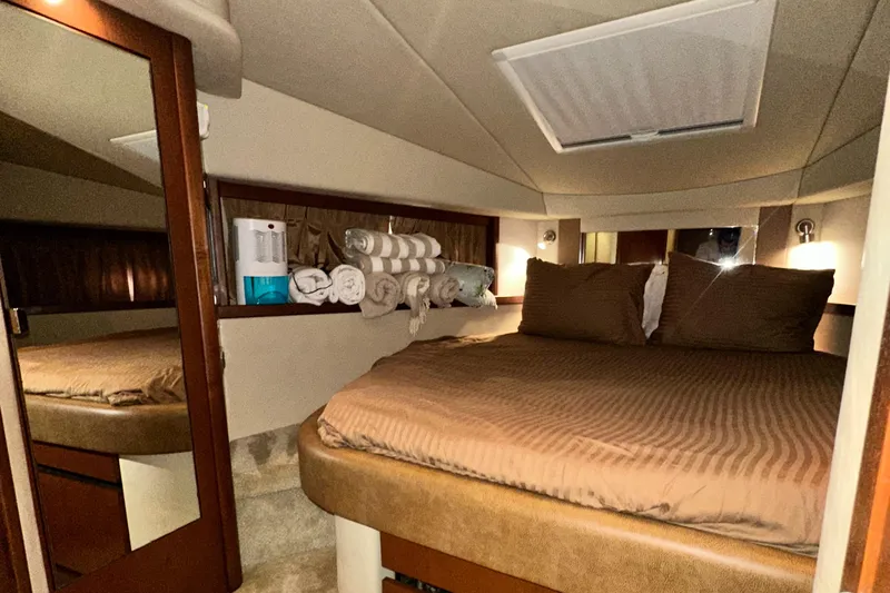 Bad Kitty Yacht Photos Pics Luxurious cabin interior of 2007 Sea Ray 380 Sundancer yacht with cozy bedding.