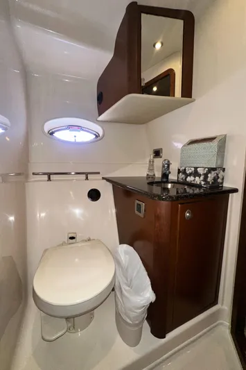 Bad Kitty Yacht Photos Pics 2007 Sea Ray 380 Sundancer bathroom with modern fixtures and wood cabinetry.