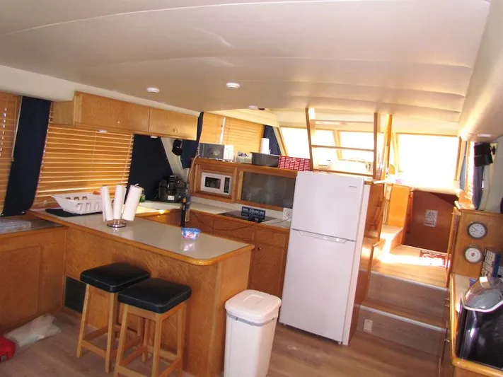  Yacht Photos Pics Interior of a 1998 Navigator 53 yacht with kitchen and seating area.
