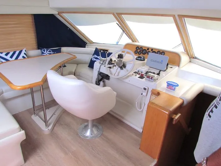  Yacht Photos Pics Interior of a 1998 Navigator 53 yacht with helm, seating, and navigation equipment.