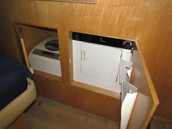  Yacht Photos Pics Laundry area inside a 1998 Navigator 53, featuring a washer and dryer.