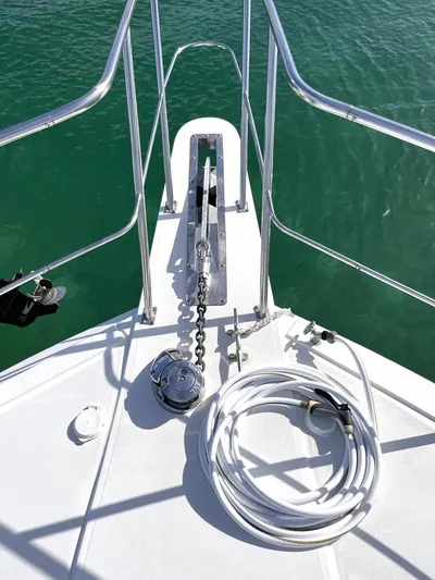  Yacht Photos Pics Bow of 1998 Navigator 53 yacht with anchor chain and coiled hose.