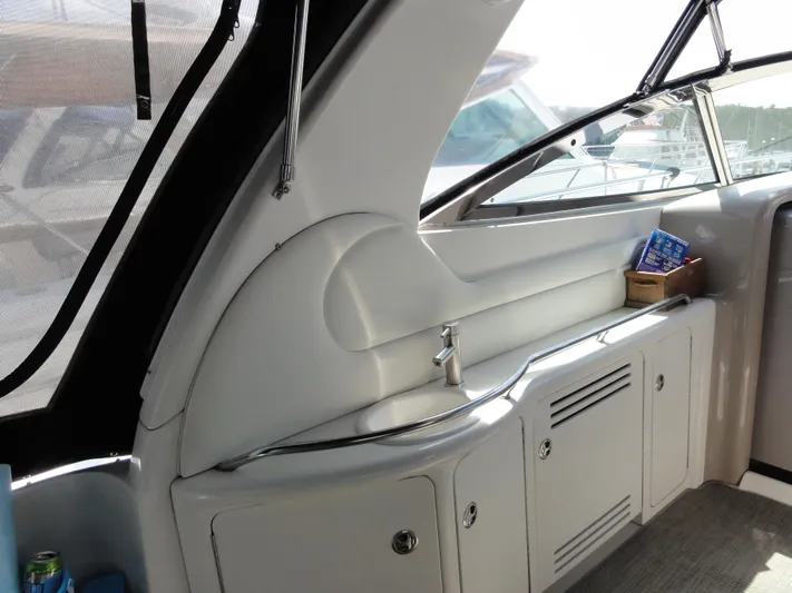  Yacht Photos Pics 2003 Sea Ray 380 Sundancer interior with sink and storage cabinets.