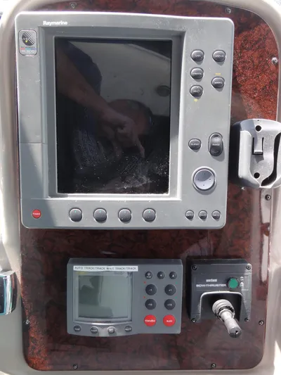  Yacht Photos Pics Control panel of a 2003 Sea Ray 380 Sundancer boat with navigation equipment.