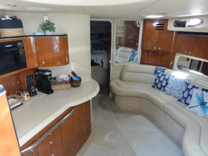  Yacht Photos Pics Interior of 2003 Sea Ray 380 Sundancer yacht with kitchen and seating area.