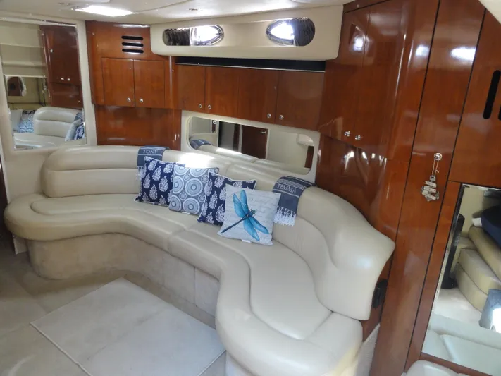  Yacht Photos Pics Luxurious interior of 2003 Sea Ray 380 Sundancer with leather seating and decorative pillows.