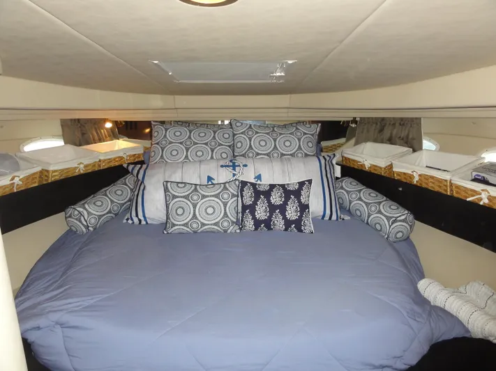  Yacht Photos Pics Cozy cabin interior of 2003 Sea Ray 380 Sundancer with decorative pillows and bedding.