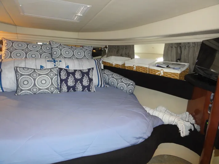  Yacht Photos Pics Cozy cabin interior of 2003 Sea Ray 380 Sundancer with decorative pillows and storage baskets.