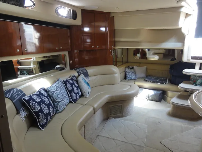  Yacht Photos Pics Luxurious interior of 2003 Sea Ray 380 Sundancer yacht with plush seating and elegant decor.