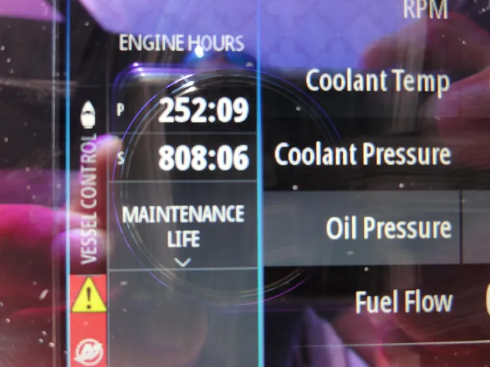  Yacht Photos Pics Display screen showing engine hours and maintenance data for 2003 Sea Ray 380 Sundancer.