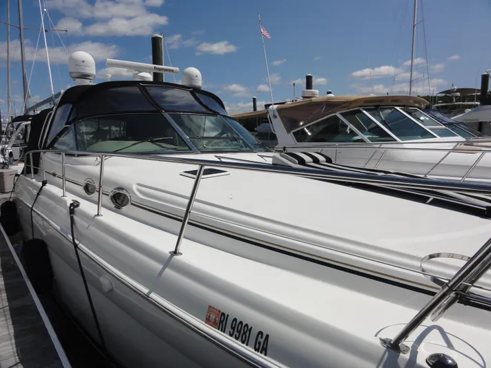  Yacht Photos Pics 2003 Sea Ray 380 Sundancer yacht docked under a clear blue sky.