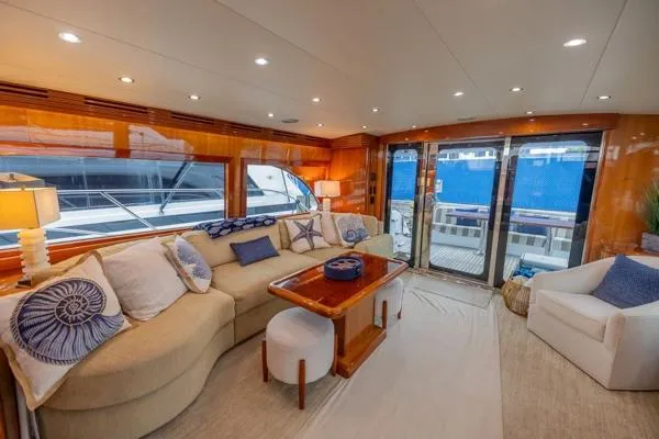 Volare Yacht Photos Pics Luxurious interior of 2006 Hatteras 64 Motor Yacht with elegant seating and decor.
