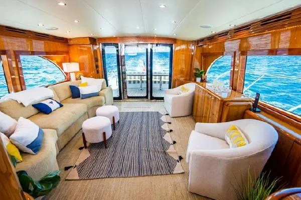 Volare Yacht Photos Pics Luxurious interior of 2006 Hatteras 64 Motor Yacht with elegant seating and ocean view.