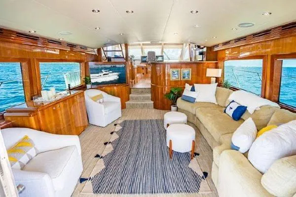 Volare Yacht Photos Pics Luxurious interior of 2006 Hatteras 64 Motor Yacht with elegant seating and ocean views.