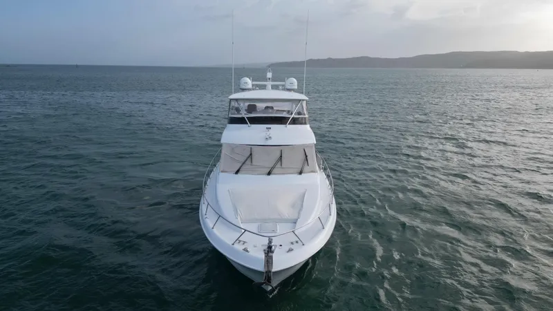 Volare Yacht Photos Pics 2006 Hatteras 64 Motor Yacht on open water, front view.