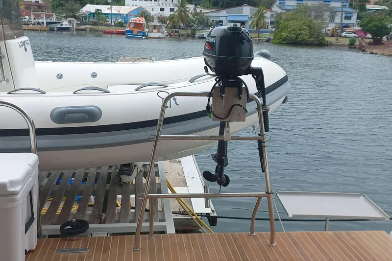 Amea Yacht Photos Pics Lagoon 52 F 2014 yacht with Suzuki outboard motor and inflatable boat on deck.