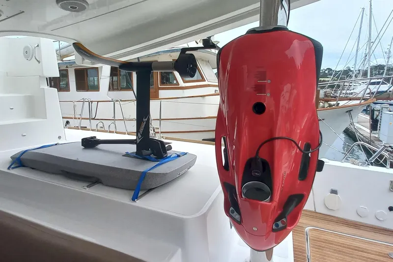 Amea Yacht Photos Pics Red water scooter on Lagoon 52 F yacht, 2014 model, docked at marina.